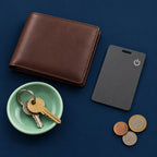 Slimfind card with a wallet and keys on a navy background